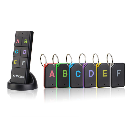 A black vertical stand displaying six colorful rectangle-shaped item locators with letters A to F on each and attached keyrings.
