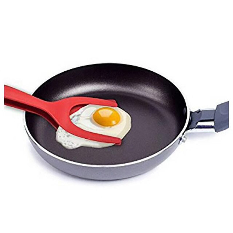 2 In 1 Grip And Flip Tongs lifting a fried egg out of a pan. The black tongs securely grip the food, showing their ergonomic and functional design for perfect egg flipping.