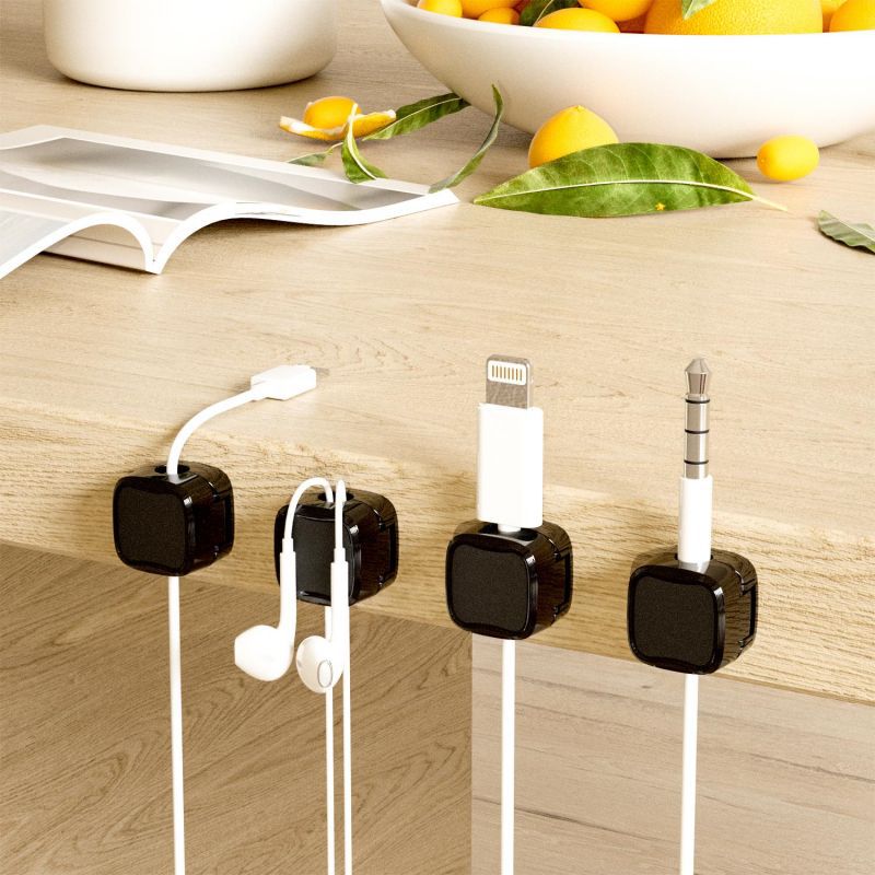 Streamlined Design: Keep your headphones and charging cables tidy on the countertop with this sleek Magnetic Wire Organizer, enhancing your space's aesthetics and functionality.