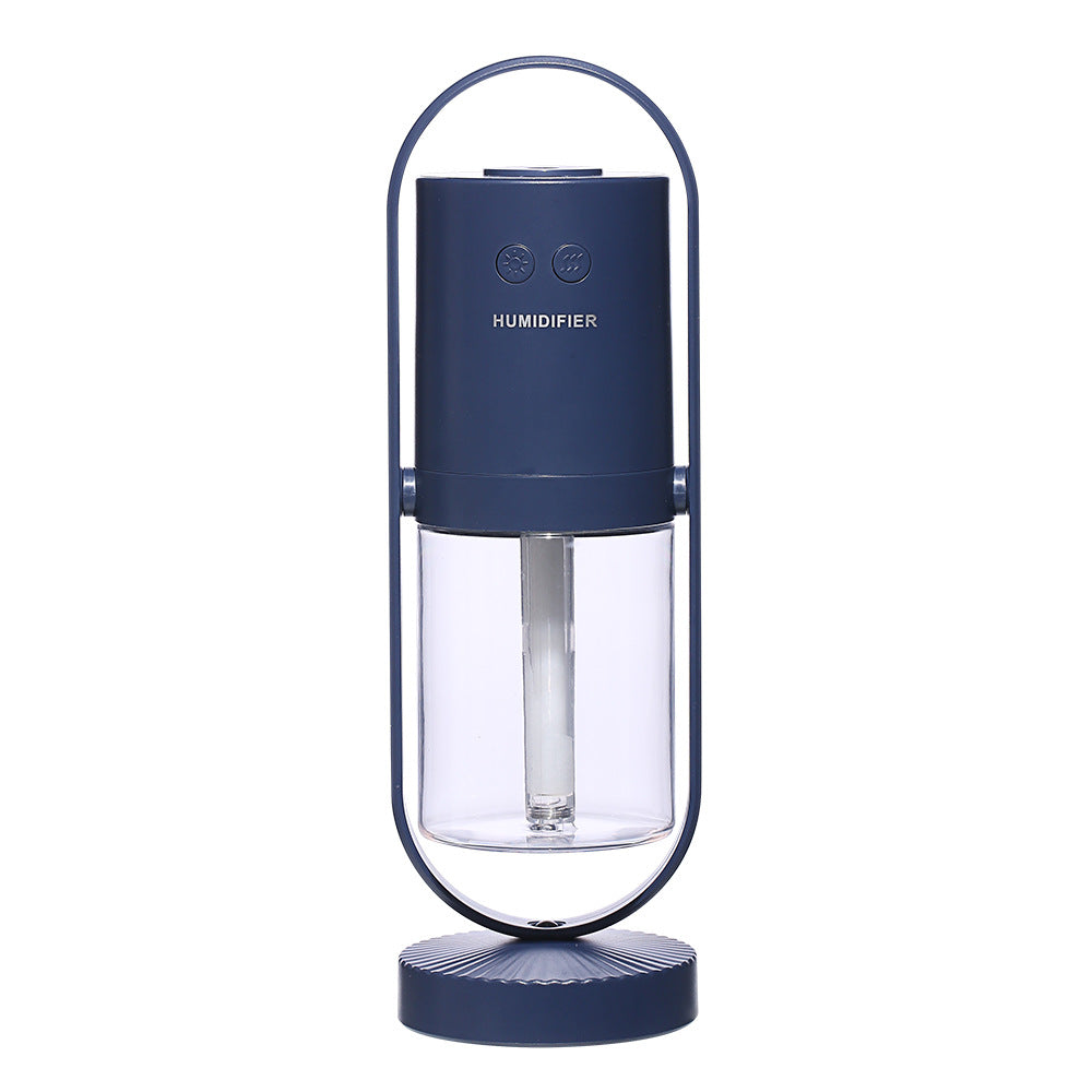 A cylindrical navy blue USB air humidifier with a transparent water tank is cradled in a metallic arc stand.