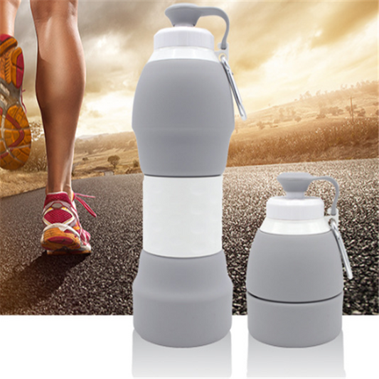 The image features a gray silicone water bottle in two states: fully expanded and half-collapsed. The background shows a runner on a road, indicating the bottle's use for sports and active lifestyles.