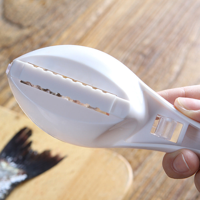 The white fish scale remover is poised above a fish on a white plate, ready for use.