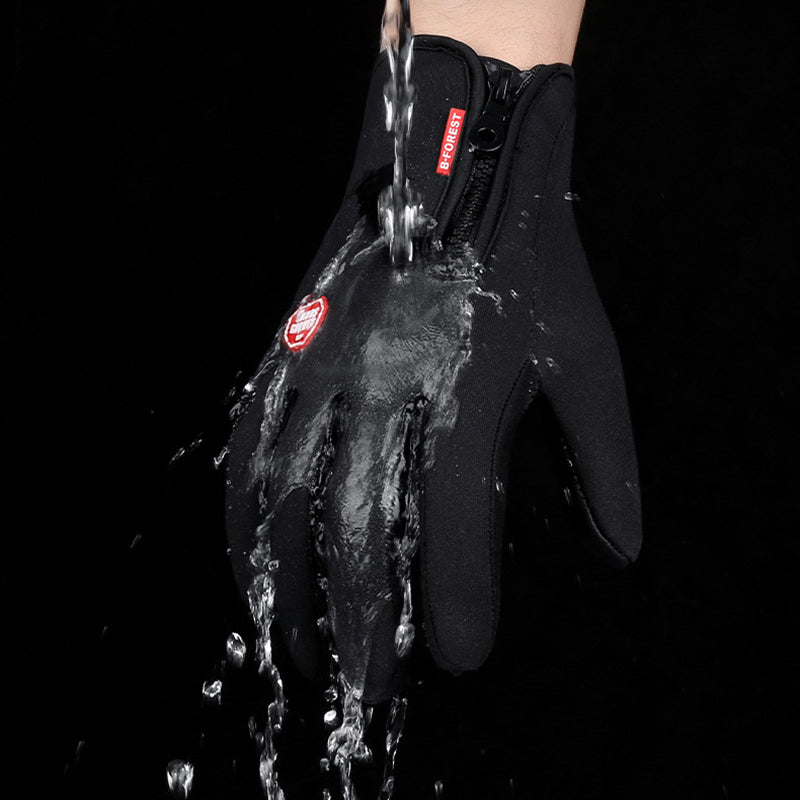 The gloves are being subjected to water to demonstrate their waterproof quality, with water droplets visibly repelling off the surface.