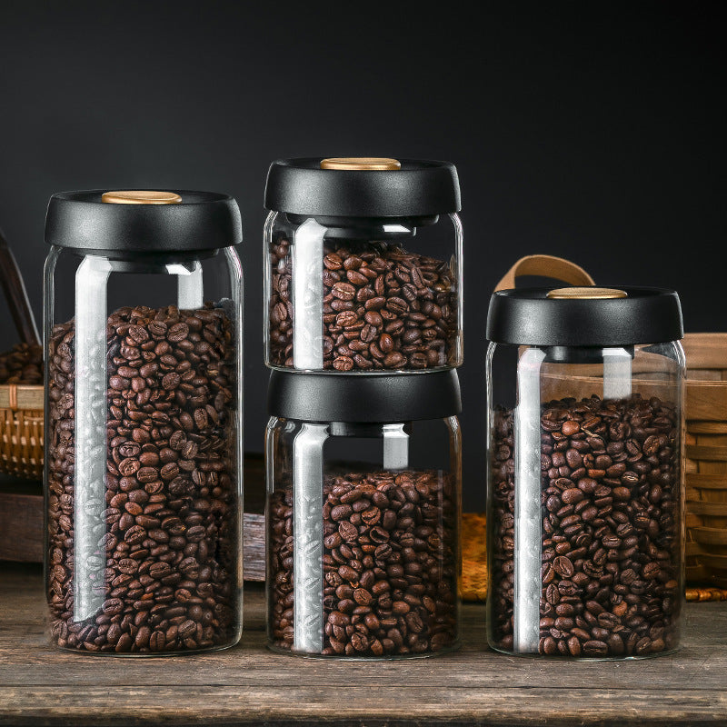 Kitchen Food Storage Jar: Multiple Kitchen Food Storage Jars filled with coffee beans are arranged together. These airtight glass jars are perfect for preserving the freshness of your coffee beans and other dry goods.