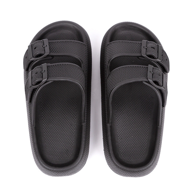 a pair of platform slippers in black colors