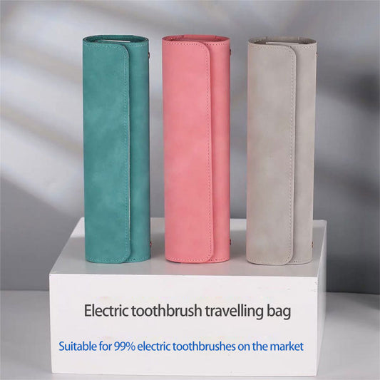 Three sleek electric toothbrush travel bags standing upright on a shelf, in colors teal, pink, and grey, labeled as suitable for 99% of electric toothbrushes on the market