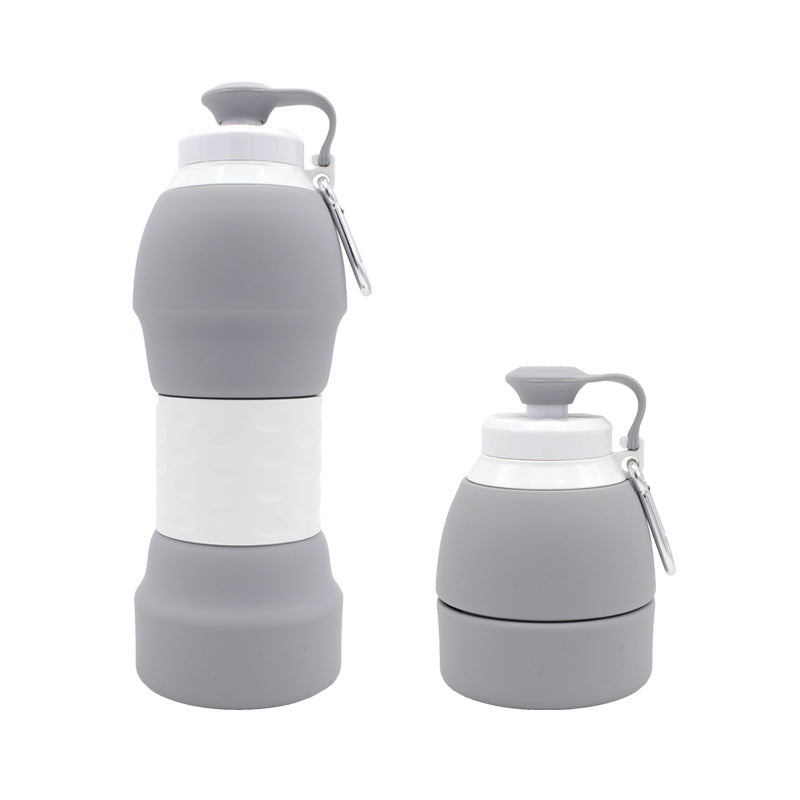 The image features a gray silicone water bottle in two states: fully expanded and half-collapsed. 