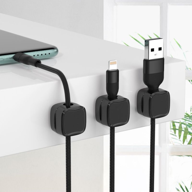 Workspace Harmony: The Magnetic Cord Organizer keeps your desk clear of clutter, securing multiple cables effortlessly, making it an essential office tool