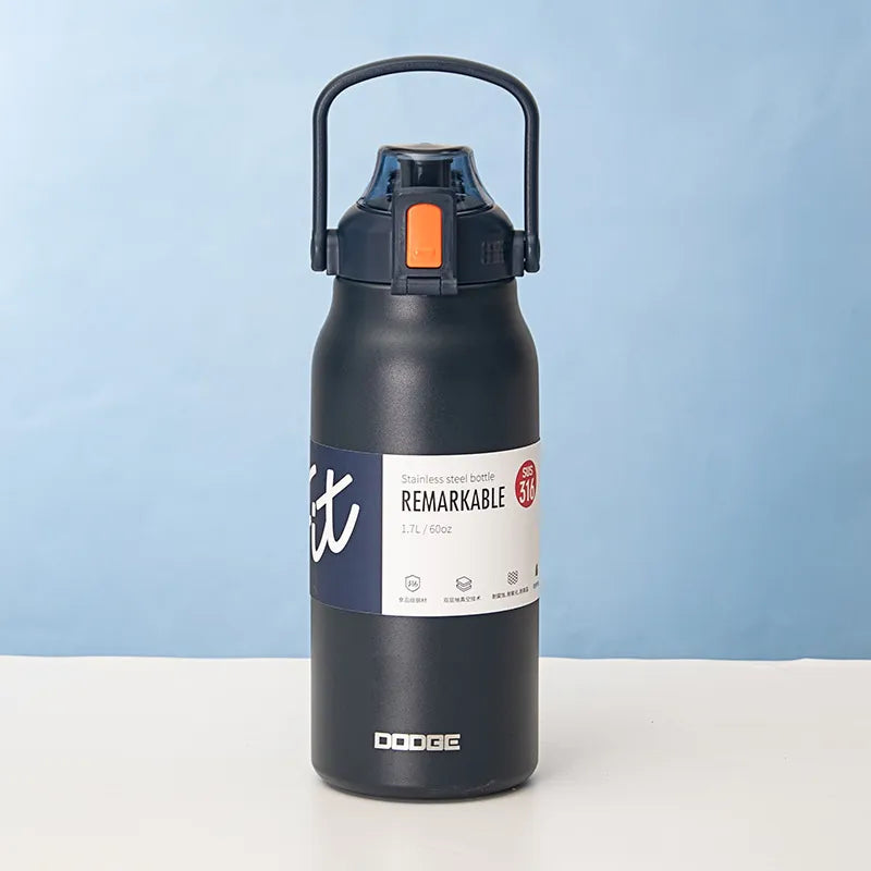 The image displays a navy blue stainless steel thermal water bottle with a sturdy handle on the lid. The bottle is labeled "REMARKABLE 316", indicating the grade of stainless steel, and has a capacity of 1.3L/45.8oz as stated on its label