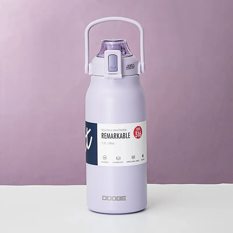 The image displays a purple stainless steel thermal water bottle with a sturdy handle on the lid. The bottle is labeled "REMARKABLE 316", indicating the grade of stainless steel, and has a capacity of 1.3L/45.8oz as stated on its label