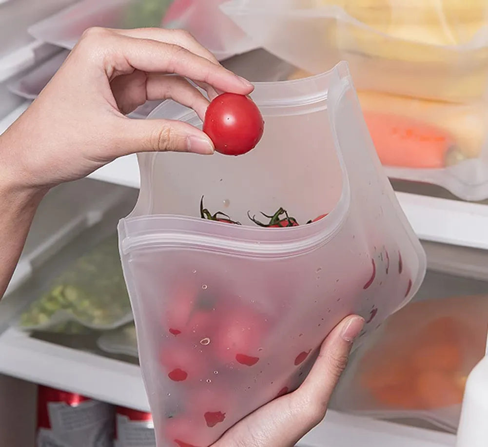 A close-up of a silicone storage bag sealed with a sliding bar, showcasing its ability to hold various fruits.