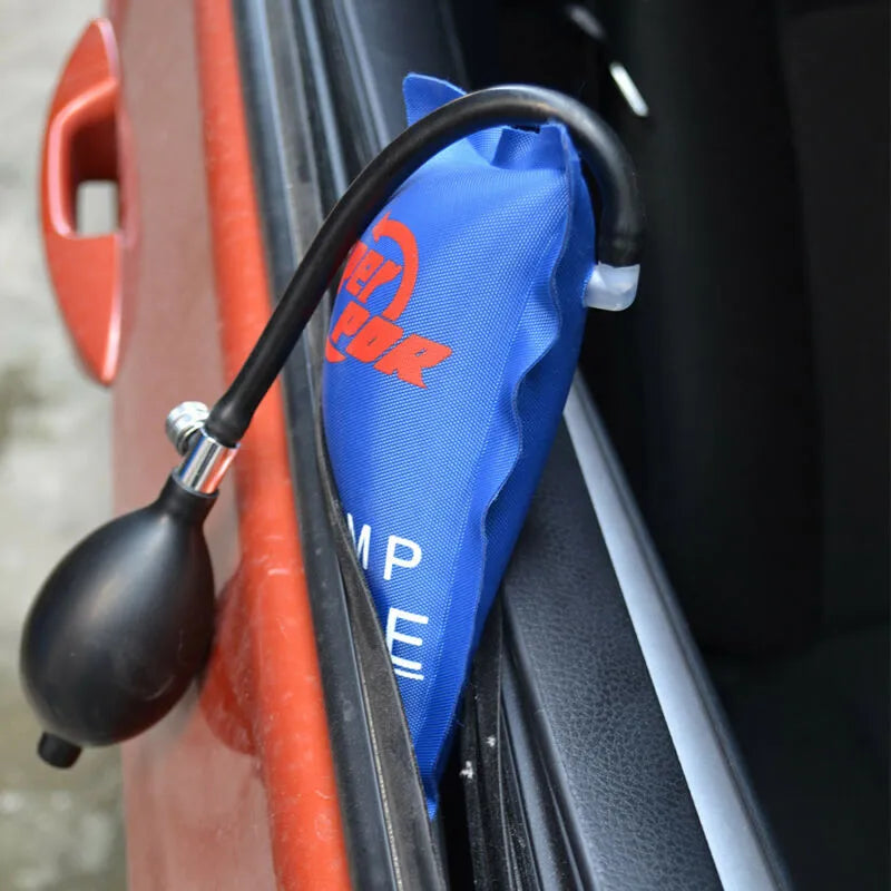 Super PDR Pump Wedge inserted into the gap of a car door, indicating its use for auto entry or to create space without damage