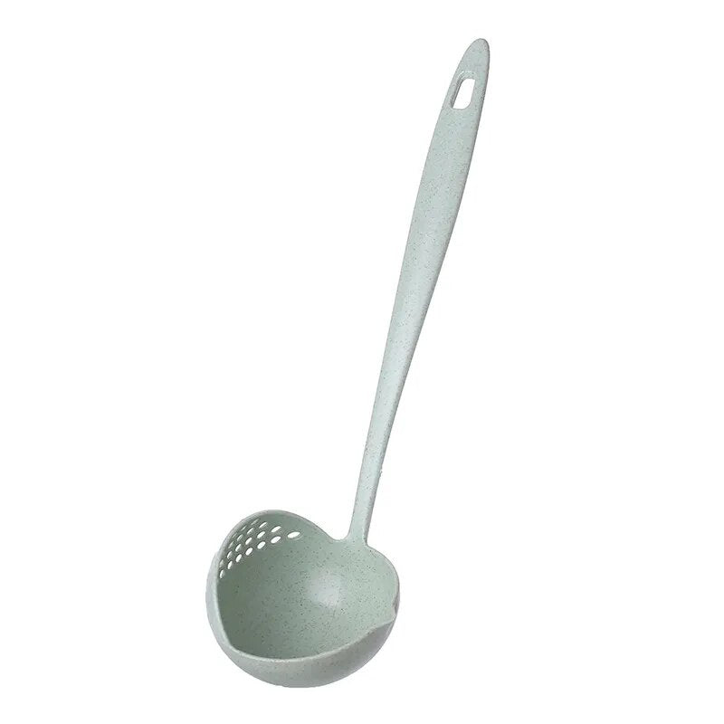 A side view of the same pastel green soup spoon ladle, showing the rounded bowl with strainer holes on one side and a long, slender handle,