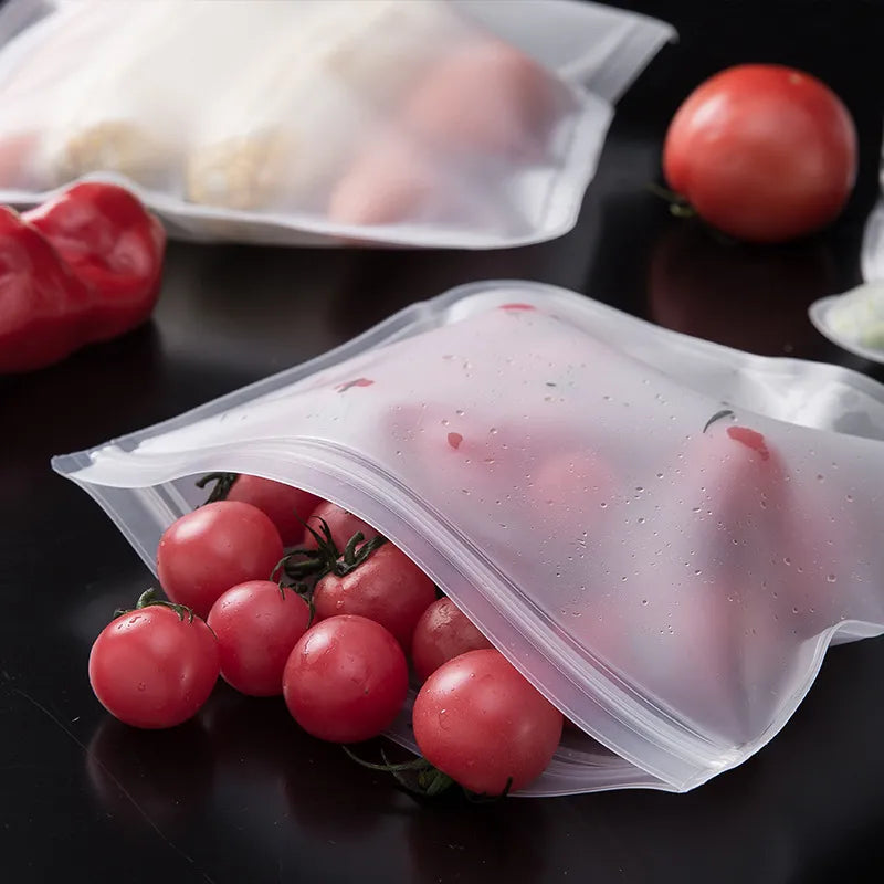 A close-up of a silicone storage bag sealed with a sliding bar, showcasing its ability to hold various fruits.