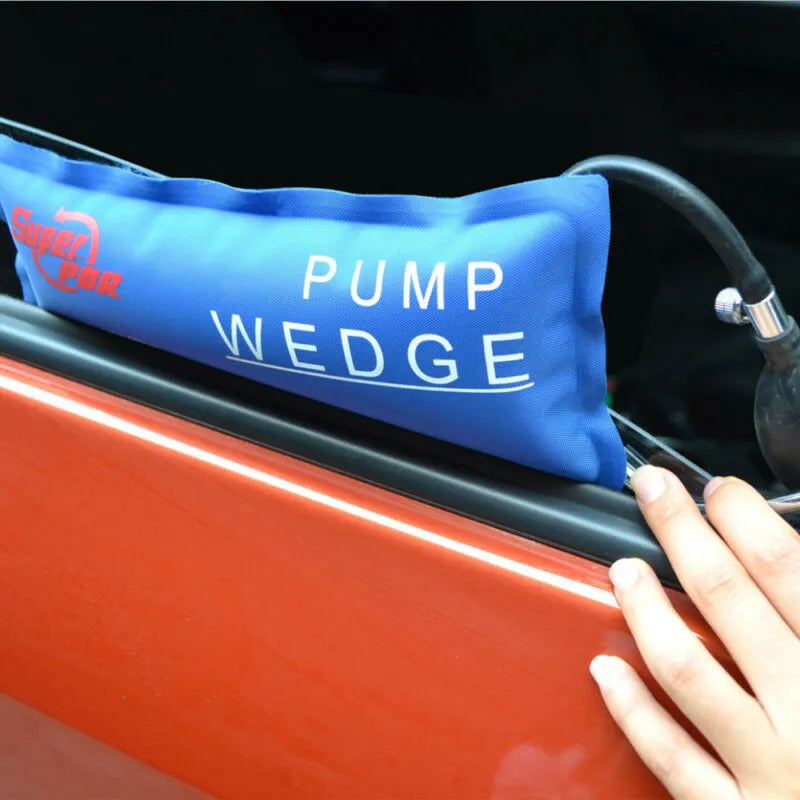 Super PDR Pump Wedge in action as it is being inserted into the gap of a slightly ajar car door, showcasing its practical application in providing access without harm to the vehicle