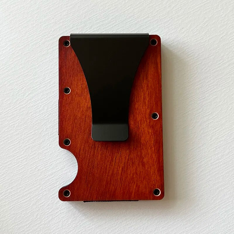 A side and front view of a slim, wood reddish card holder with elastic cash strap, showcasing a thin profile and a compartment holding US currency notes.