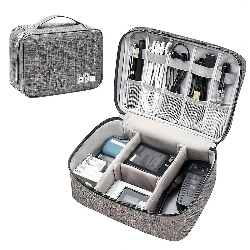  A waterproof cable storage bag in grey, showcasing its spacious design with multiple compartments to organize cables and electronic accessories.