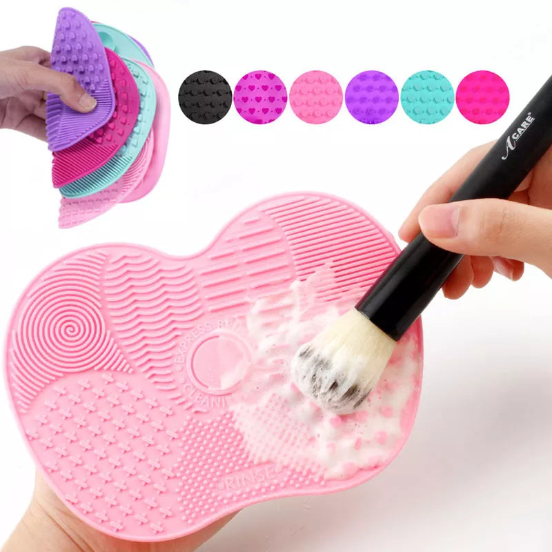 A collage showing a hand using a pink Silicone Makeup Brush Cleaner Pad with different textured areas labeled, such as 'Circle Zone', 'Striped Zone', and 'Star Zone', highlighting the various cleaning surfaces.