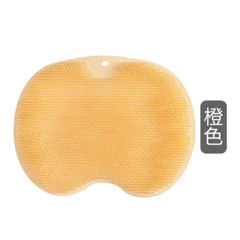 Yellow silicone back scrubber is displayed, each with a contoured shape and bristles on the surface.