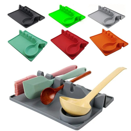 A collection of silicone spoon rests in various colors (black, green, grey, red, and orange) is presented, alongside a grey one in use, organizing multiple kitchen utensils.