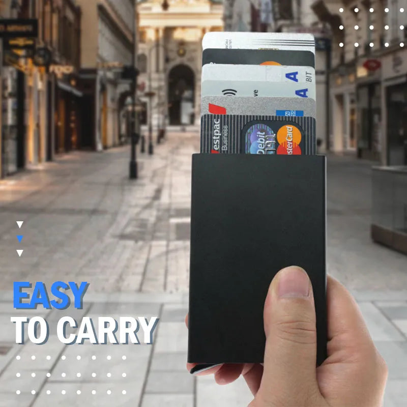 The wallet being held in hand, with a focus on the thumb pushing a card up, showing the convenience of the card pop-out feature.