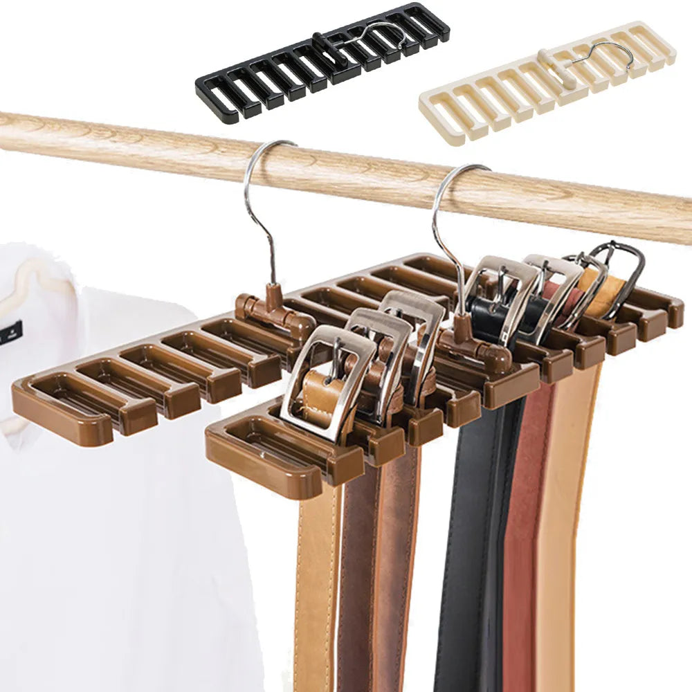 The image displays a space-efficient closet organizer, specifically a tie and belt hanger with slots. Multiple belts are neatly hung on the organizer, which is suspended from a wooden closet rod. Above, two additional hangers in black and cream colors are shown, suggesting the product's color variety.