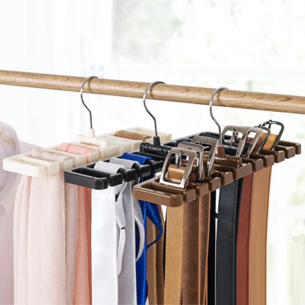 belts with various buckles are neatly arranged on a brown hanger, highlighting the organizer's practical design and use.