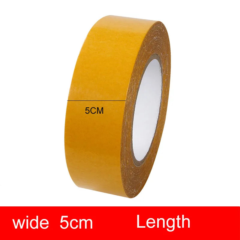 A 5cm wide roll of the double-sided tape, with its length dimension not specified.