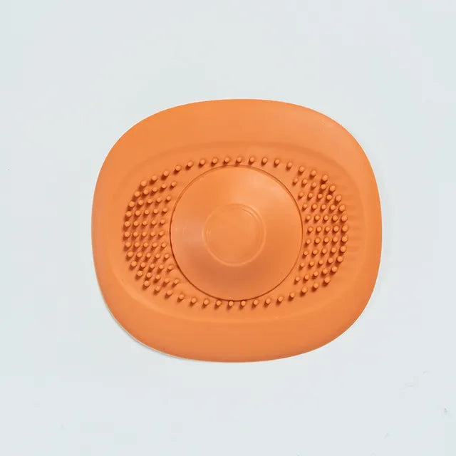 An orange strainer is placed over a yellow backdrop, a blue strainer over an orange backdrop, and a dark blue strainer over a light blue backdrop, each emphasizing the color contrast and design.