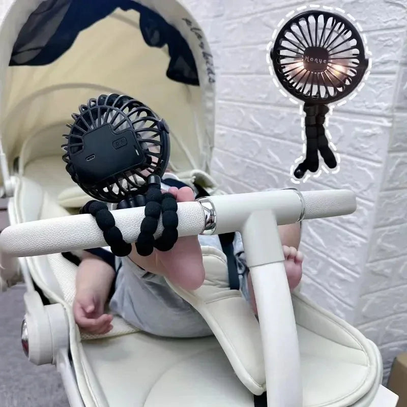 A clip-on fan securely attached to a baby stroller handle, providing a cool breeze to the baby sitting in the stroller.