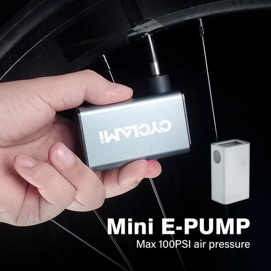 The A3 Mini Electric Air Pump is shown inflating a bicycle tire. This portable bicycle pump can reach up to 100 PSI, ensuring your tires are always at optimal pressure.