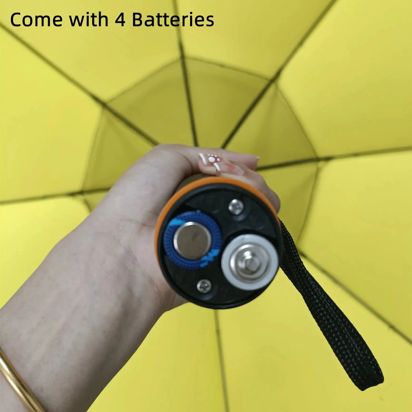 The Creative Summer Umbrella with Fan and Mist Spray, showing it comes with four AA batteries. These batteries power the fan and mist spray functions, ensuring cool comfort all day long.