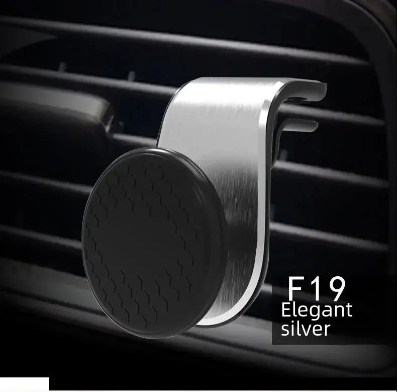 The image shows a close-up of the car phone holder with a sleek, elegant silver finish. The holder is described as "F19 elegant silver," highlighting its stylish and modern appearance, adding a touch of sophistication to any car interior.