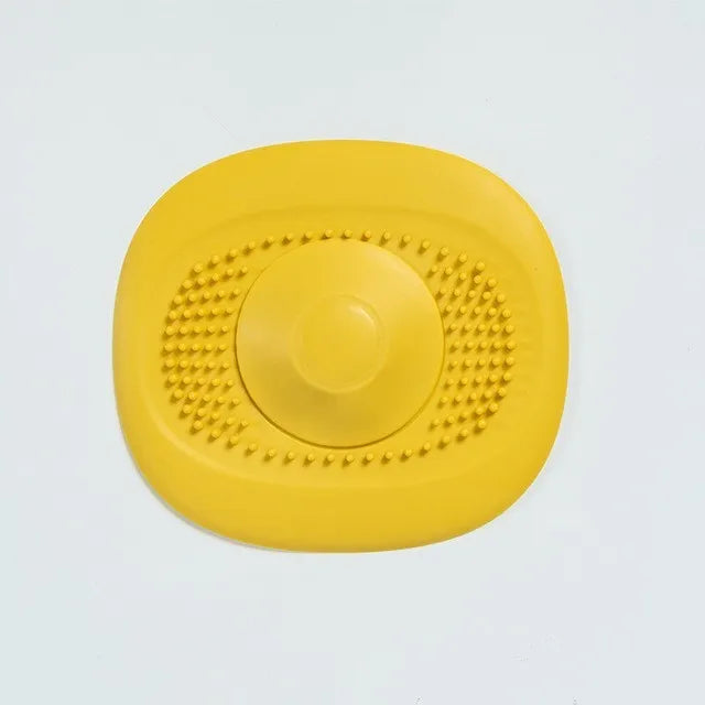 An yellow strainer is placed over a yellow backdrop, a blue strainer over an orange backdrop, and a dark blue strainer over a light blue backdrop, each emphasizing the color contrast and design.