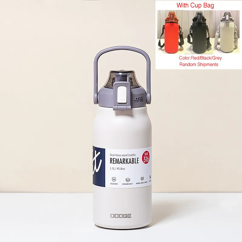 The image displays a white stainless steel thermal water bottle with a sturdy handle on the lid. The bottle is labeled "REMARKABLE 316", indicating the grade of stainless steel, and has a capacity of 1.3L/45.8oz as stated on its label