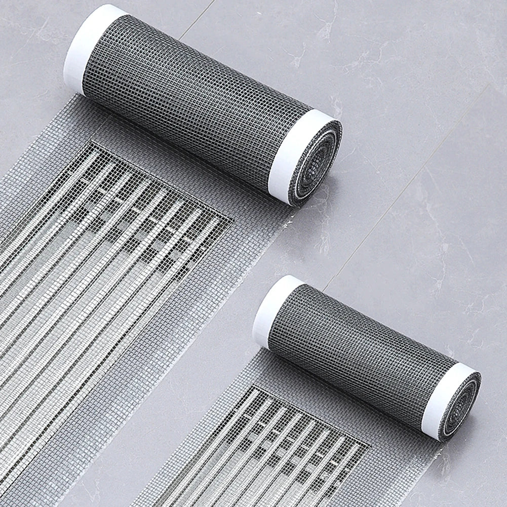 Image 1: The Disposable Shower Drain Hair Catcher shown in use, effectively covering a shower drain with its cuttable waterproof mesh. This image highlights how the mesh filter can be customized to fit various drain sizes and shapes.