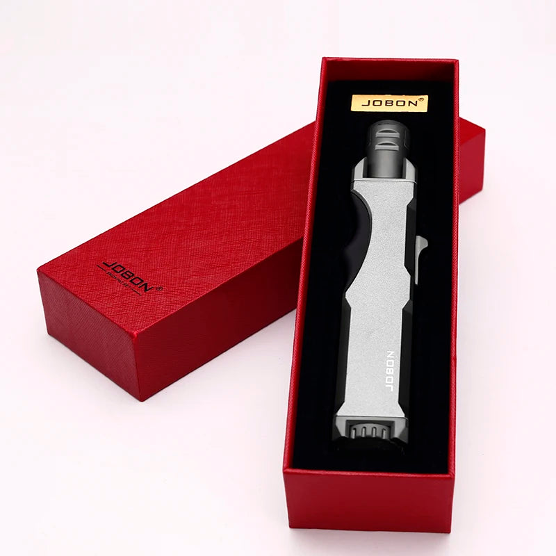 The windproof torch lighter in its elegant red box, highlighting the high-quality packaging. This butane lighter makes an excellent gift for various occasions.