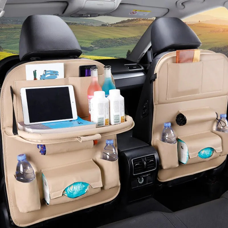 Car Seat Back Organizer - Spacious Storage: This image features the organizer in a beige color, holding various items like drinks and tablets. The foldable table tray is in use, providing a spacious and organized storage solution for car interior