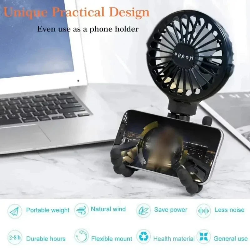 The portable fan is used as a phone holder on a desk, offering dual functionality and cooling convenience.