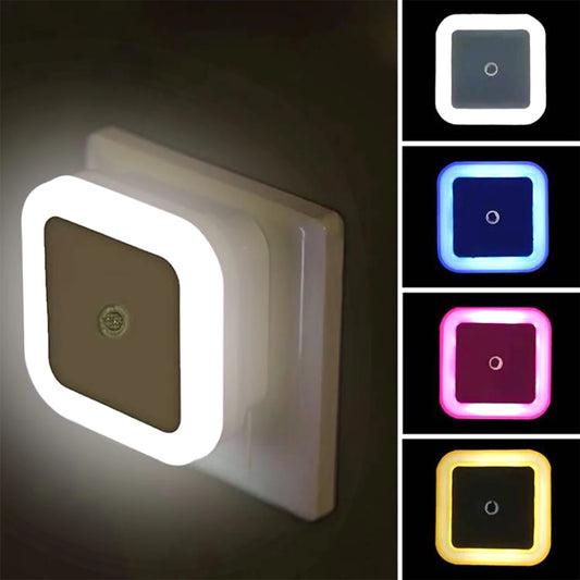 The Wireless LED Night Light Sensor is shown in various colors, including white, blue, red, and yellow. This compact nightlight plugs into any standard outlet and emits a soft, soothing glow, perfect for bedrooms or hallways. Its modern, square design blends seamlessly with any decor, providing both functionality and style.