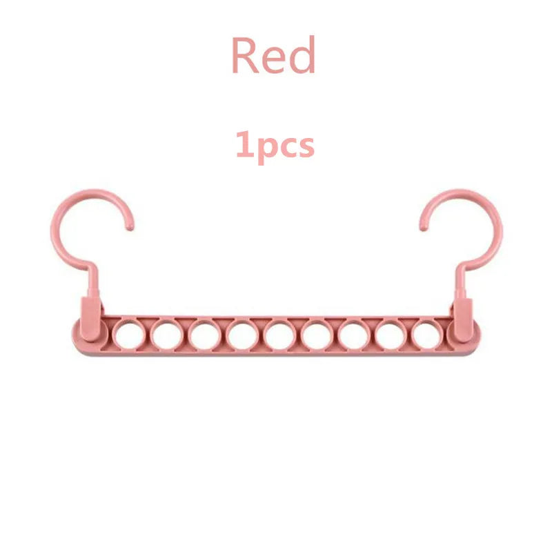 multi-port hanger in gray, white, and pink showcases the color variety and the nine-hole branch design for multiple garments.