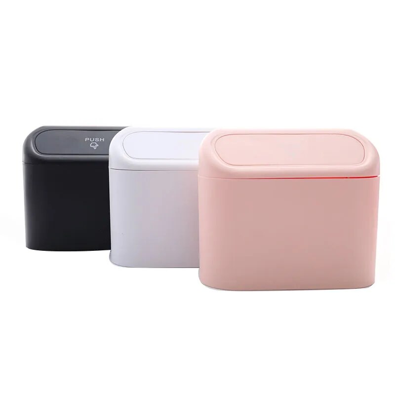 The trash bin is available in different colors, showcased in three variations: black, soft pink, and cream, offering aesthetic choices for personalization.