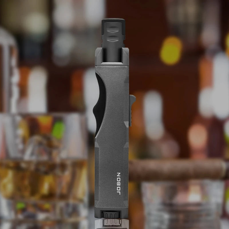 The black windproof torch lighter displayed on a bar counter, emphasizing its elegance and effectiveness. This butane torch is a must-have for outdoor enthusiasts.