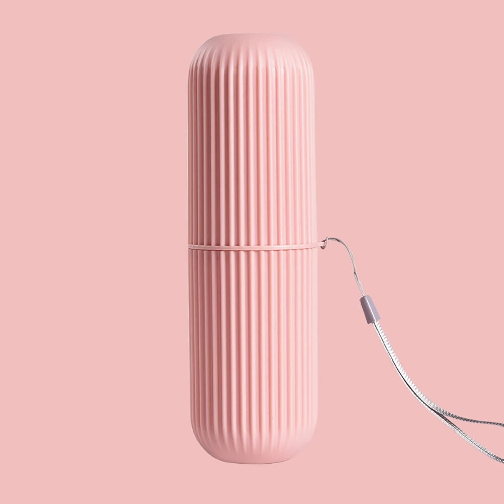 A single pink toothbrush cup with its cap secured, set against a white backdrop.