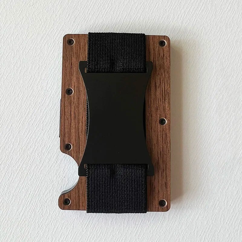 A side and front view of a slim, black card holder with elastic cash strap, showcasing a thin profile and a compartment holding US currency notes.