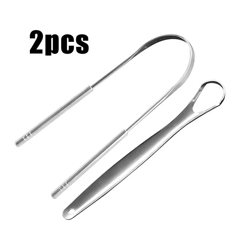 The image shows two stainless steel tongue scrapers. They have a sleek, metallic finish with a curved cleaning edge at one end and a rounded handle at the other. The text "2pcs" suggests the items come as a pair.