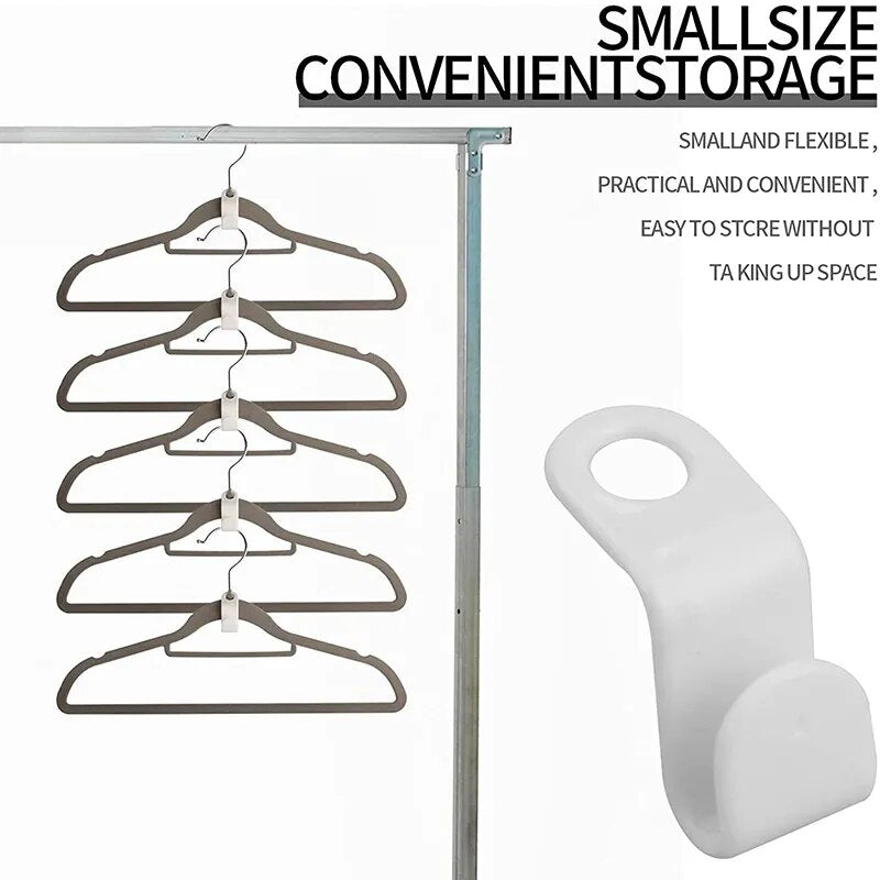 An array of white clothes hanger connector hooks is displayed, each with a simple design featuring a slot at one end to attach to a hanger and a hook at the other.