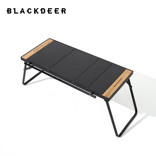 "The BLACKDEER Traveler Modular Combination Desk, a folding camping table, is shown fully assembled. Its sleek black tabletop is supported by a sturdy aluminum frame, ideal for outdoor activities."