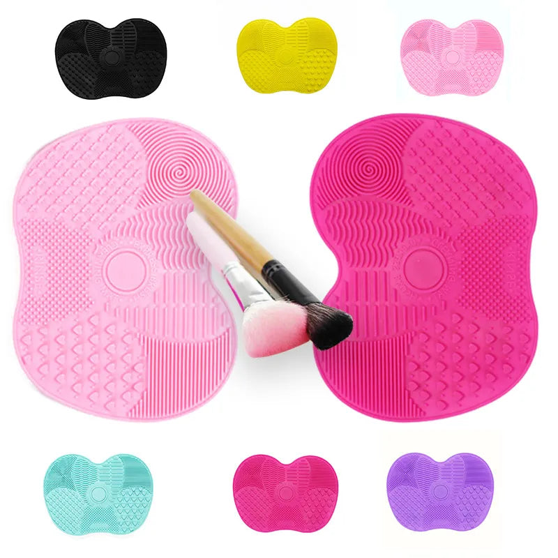 This image displays various colored heart-shaped Silicone Makeup Brush Cleaner Pads, including teal, pink, black, and yellow, showcasing the different color options available for the product.