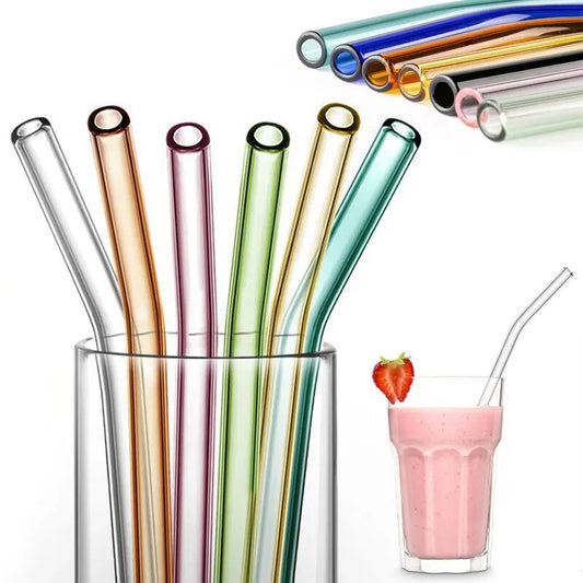 A collection of colorful glass straws in varying hues such as blue, green, and red, showcased vertically in a clear glass container.